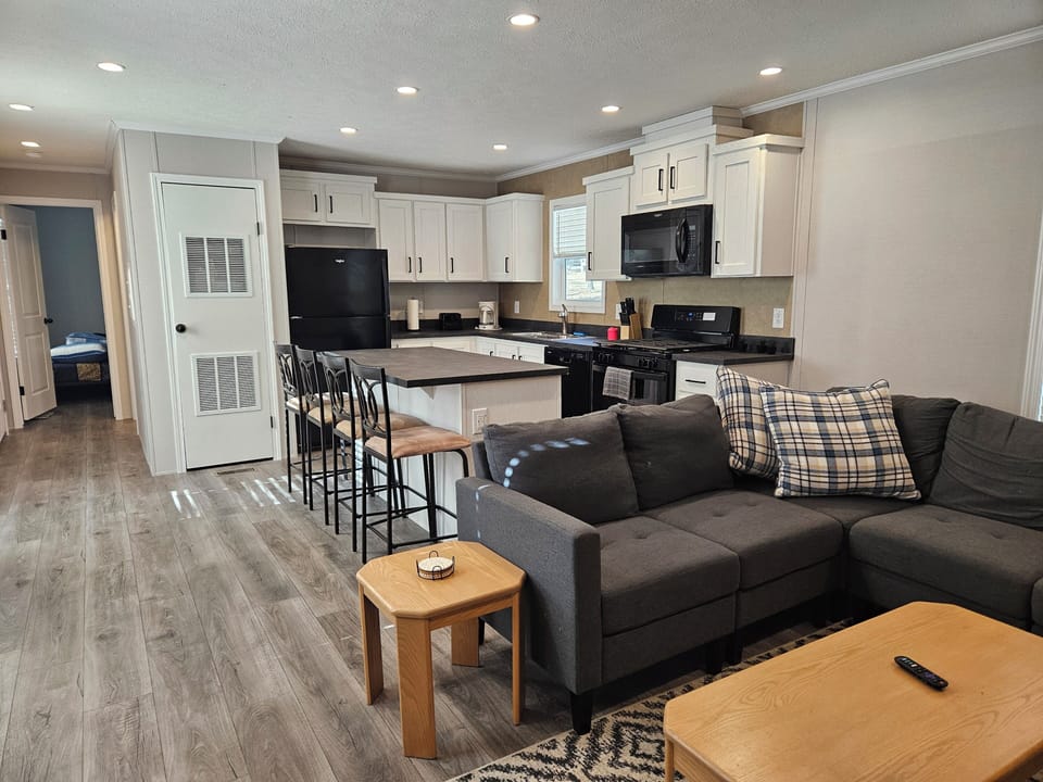 Open floor plan to have everyone in one place. Kitchen is right off the living room. 