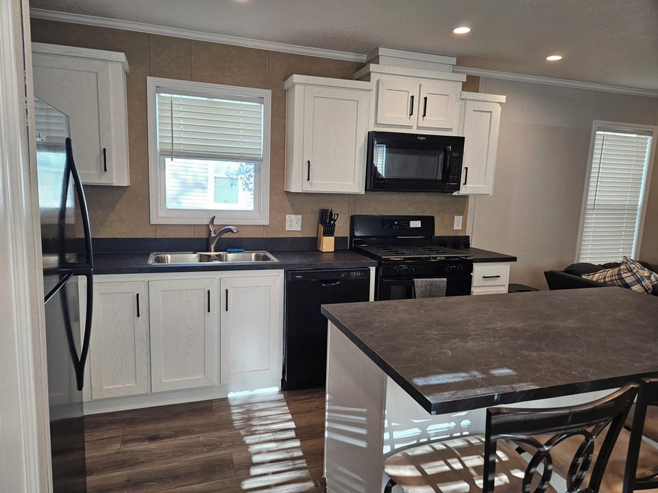 Full kitchen with all cooking essentials included.  Also pictured is the sitting island with room for your family. 