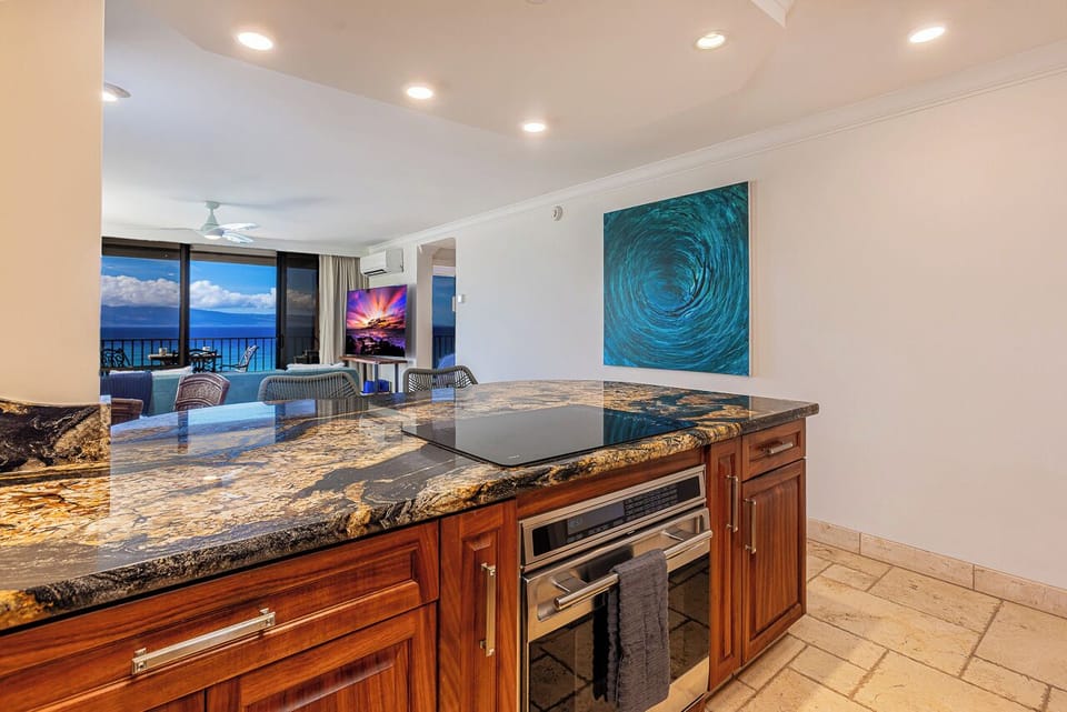 Ocean breezes and natural light flow through this stylish kitchen space