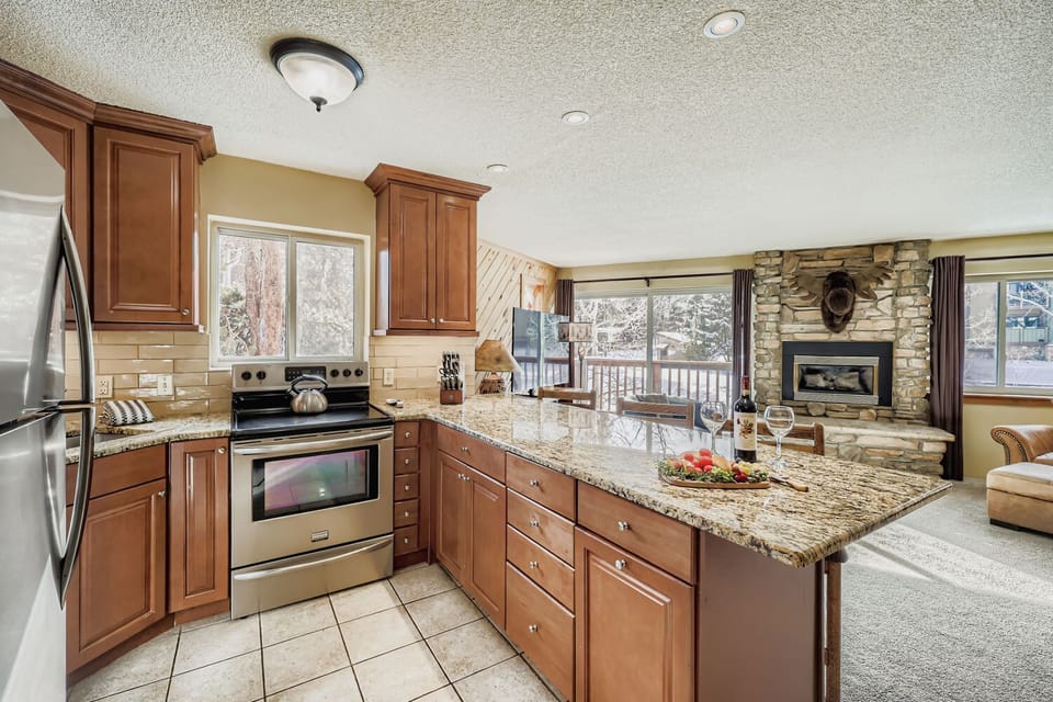 Open kitchen with seating for 3 at breakfast bar