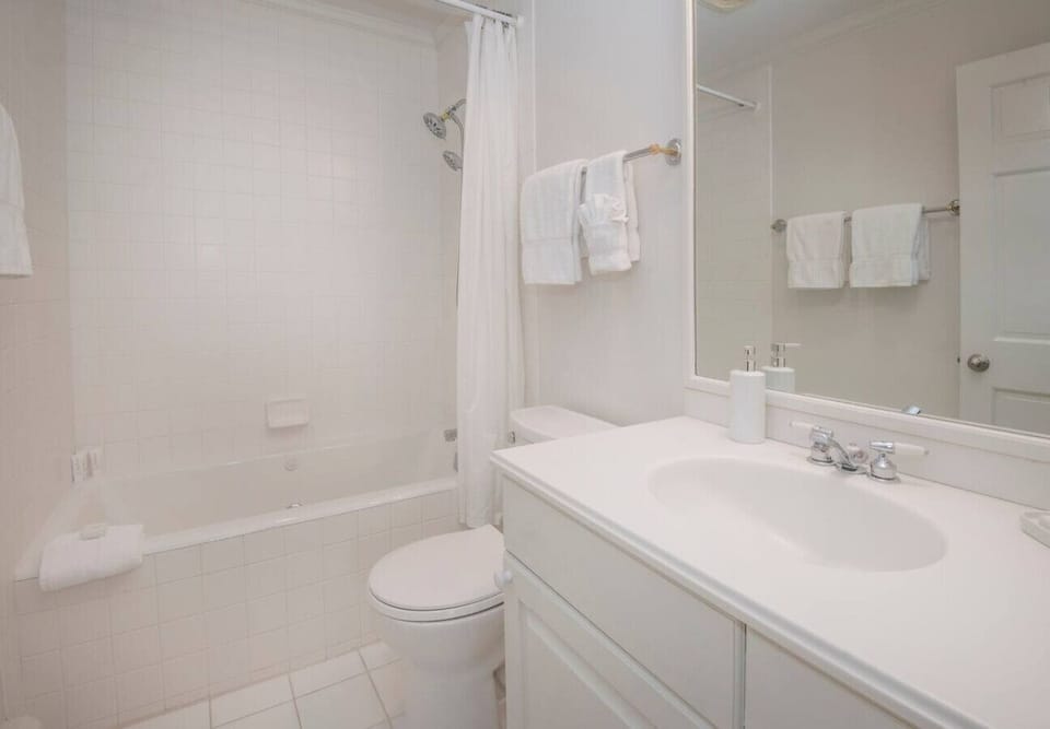 Primary bedroom with king bed and en suite bathroom
