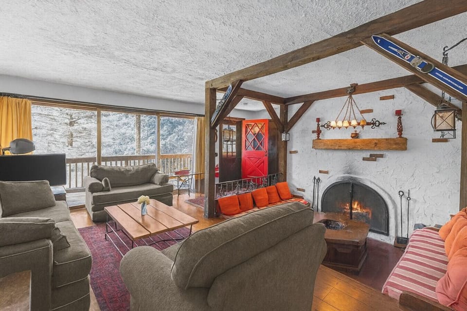 View of cozy den and living room