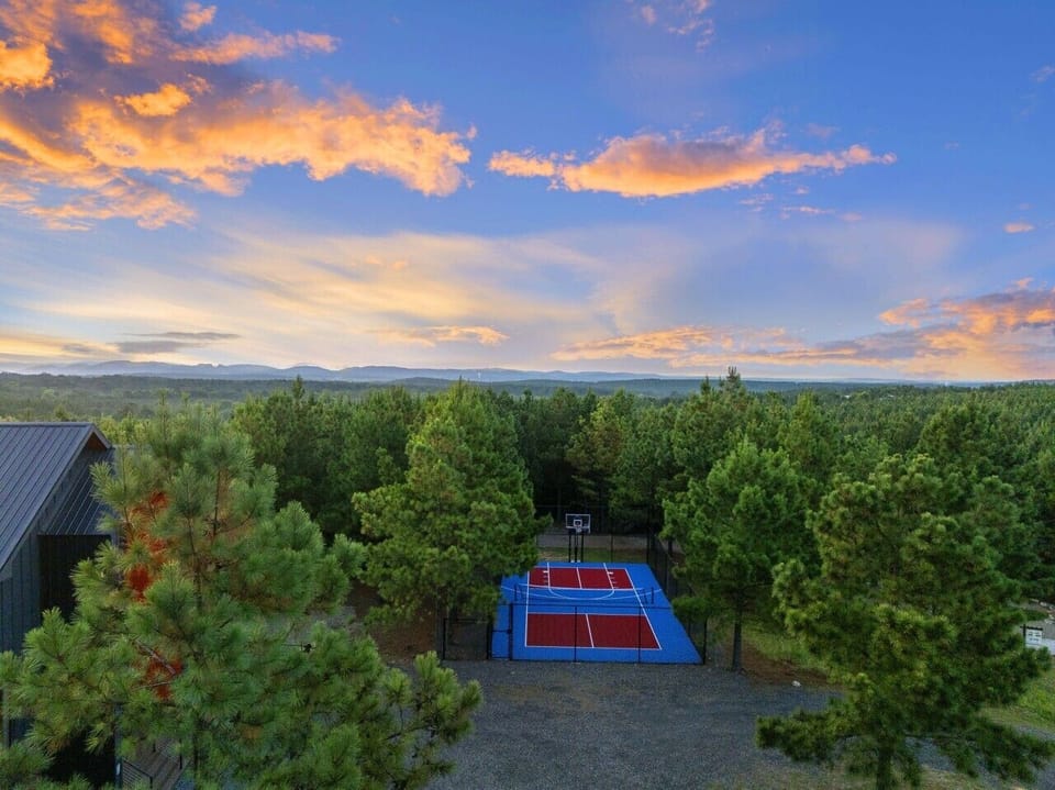 Aerial view of the home and private sports court