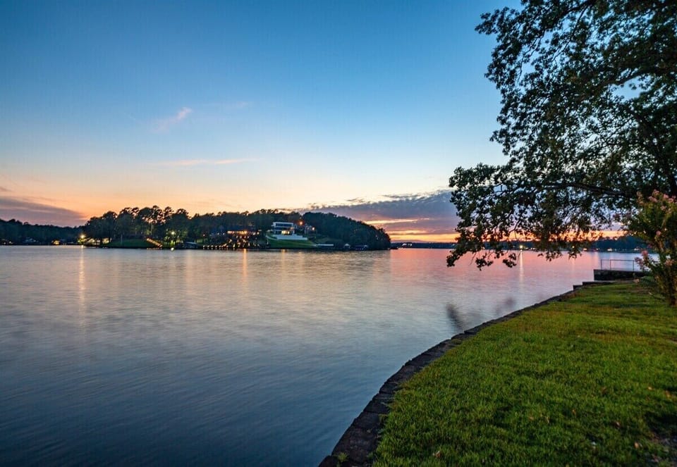 Peaceful lake views with vibrant sunsets.