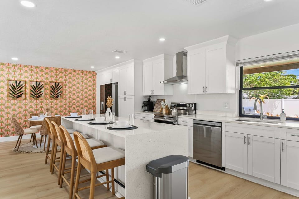 A bright, modern kitchen stocked with the essentials for your stay.