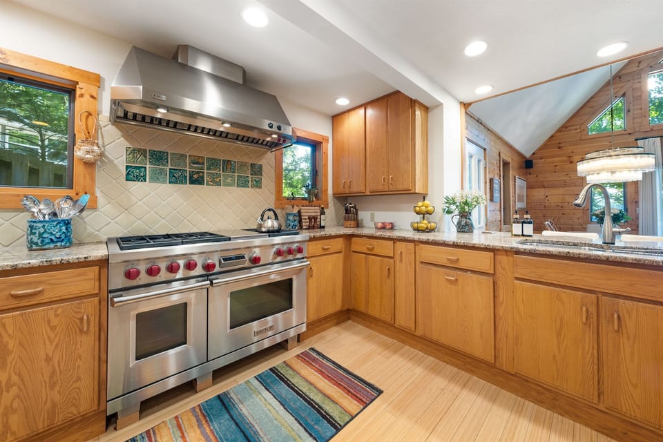 Cook unforgettable meals together in the gourmet kitchen, featuring a 48” professional Wolf stove — where family recipes come to life, stories are shared, and everyone gathers around the heart of the home.