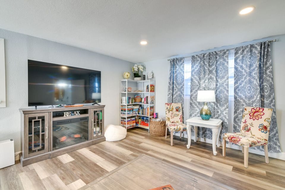 Living Area | Bright Entertainment Space with Smart TV & Game Shelf