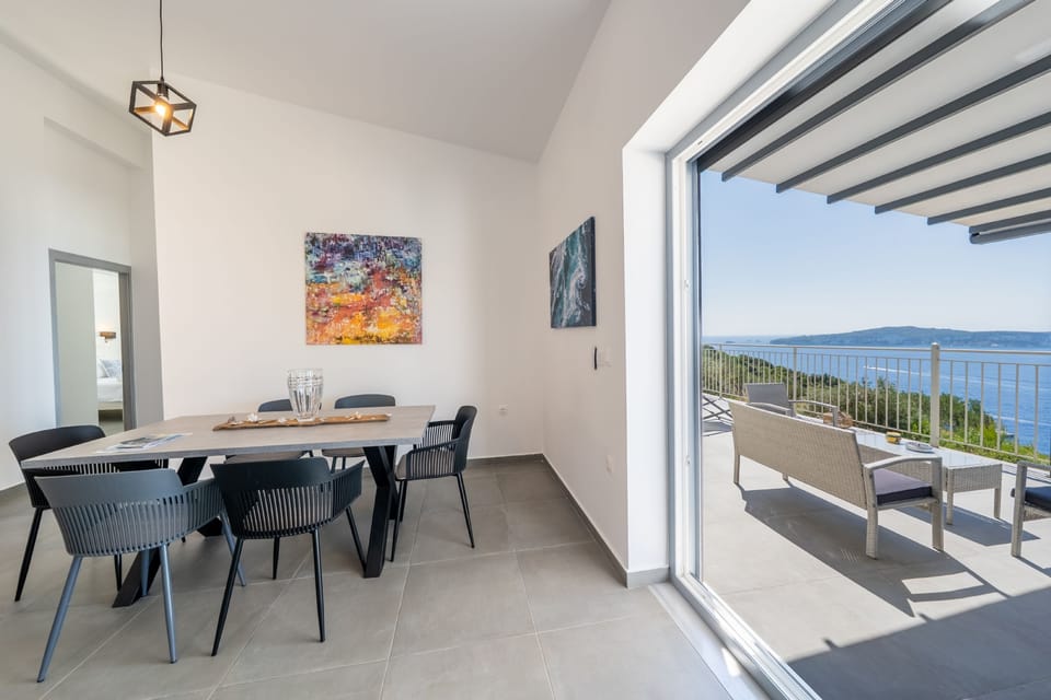 Modern dining and living area with a shady sun terrace