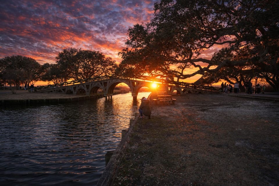 Sunset sound-side view of the Wooden Footbridge in Corolla Historic Park
