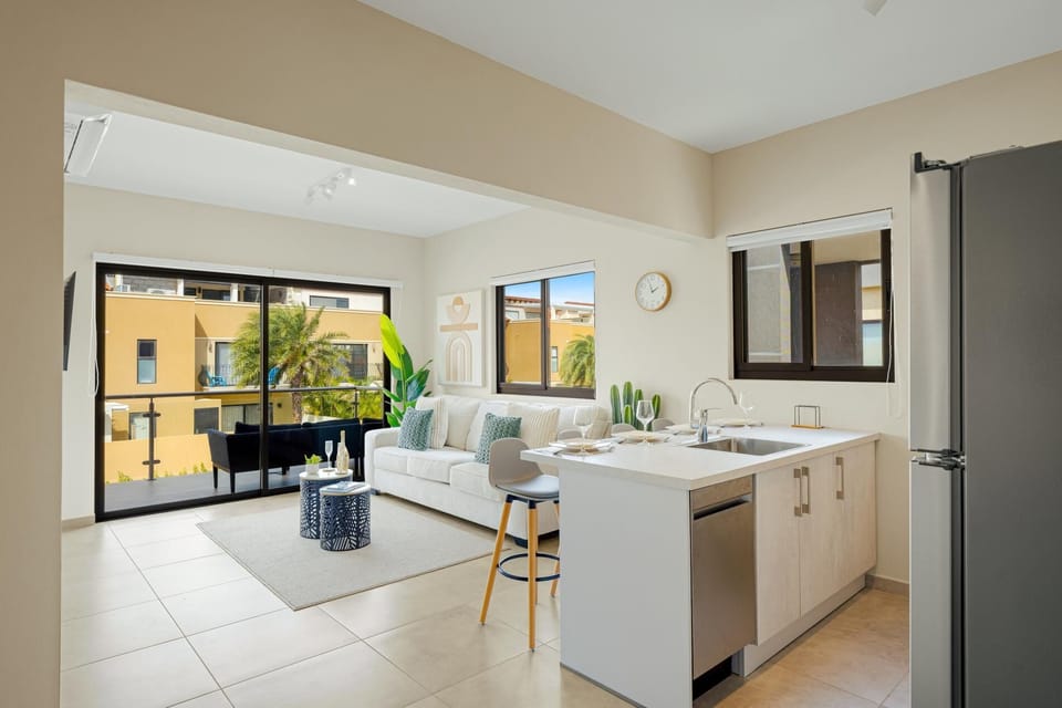 Unwind, your way. Sink into the deep comfort of the living room sofa or slide open the glass doors and step out to enjoy the breeze on your private balcony. The perfect blend of relaxation is waiting.