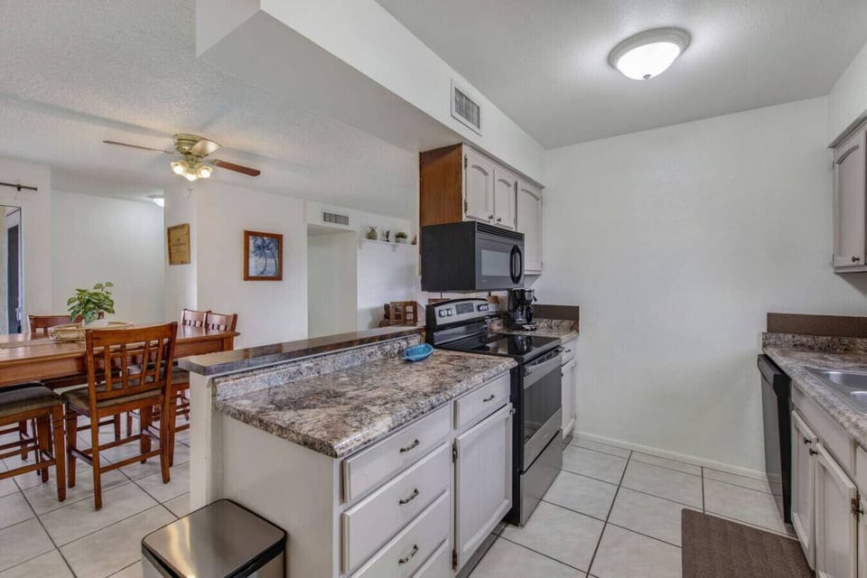 Kitchen with breakfast counter and dining area