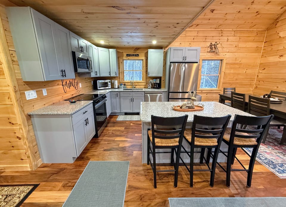 Open living kitchen and dining areas.