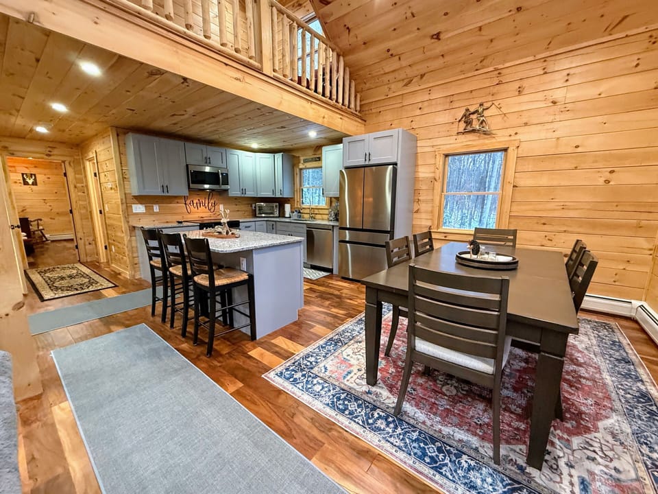 Open living kitchen and dining areas.