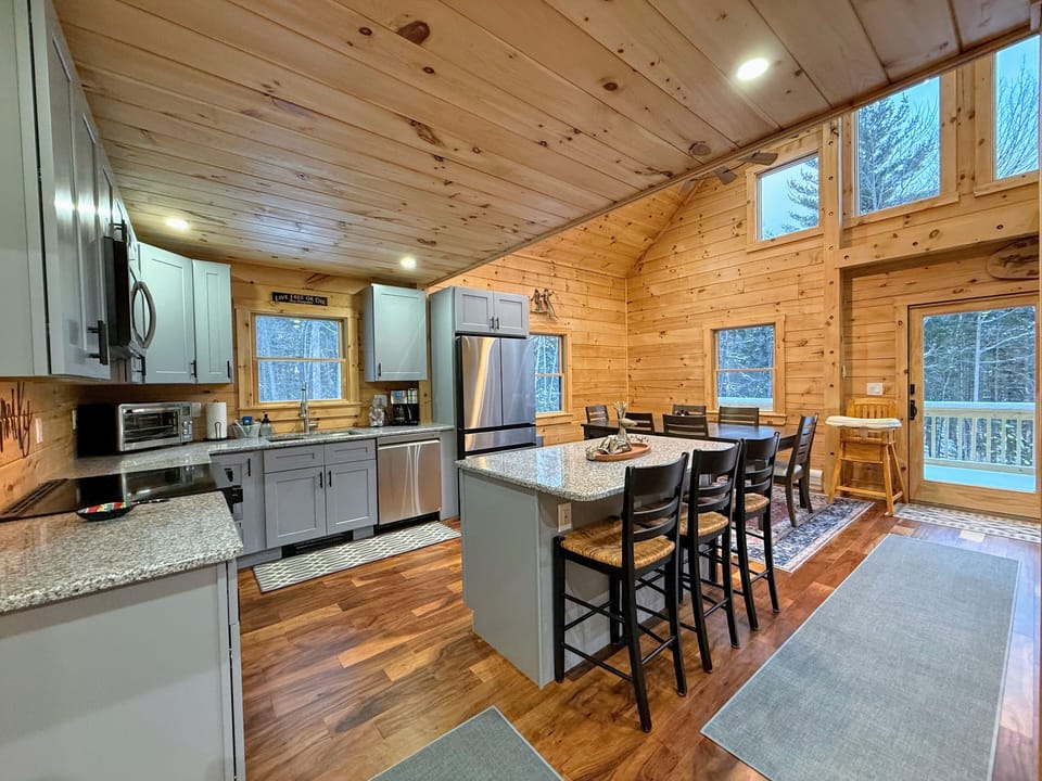 Open living kitchen and dining areas.