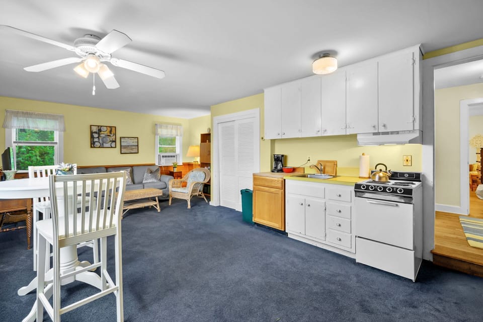 Step down to the open concept dining, kitchen and living areas