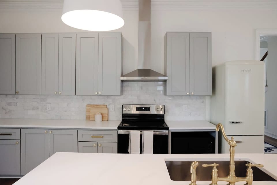 Lots of counter and cabinet space make for easy entertaining. The kitchen comes complete with stovetop, oven, microwave, fridge, freezer, and Keurig coffee maker. 