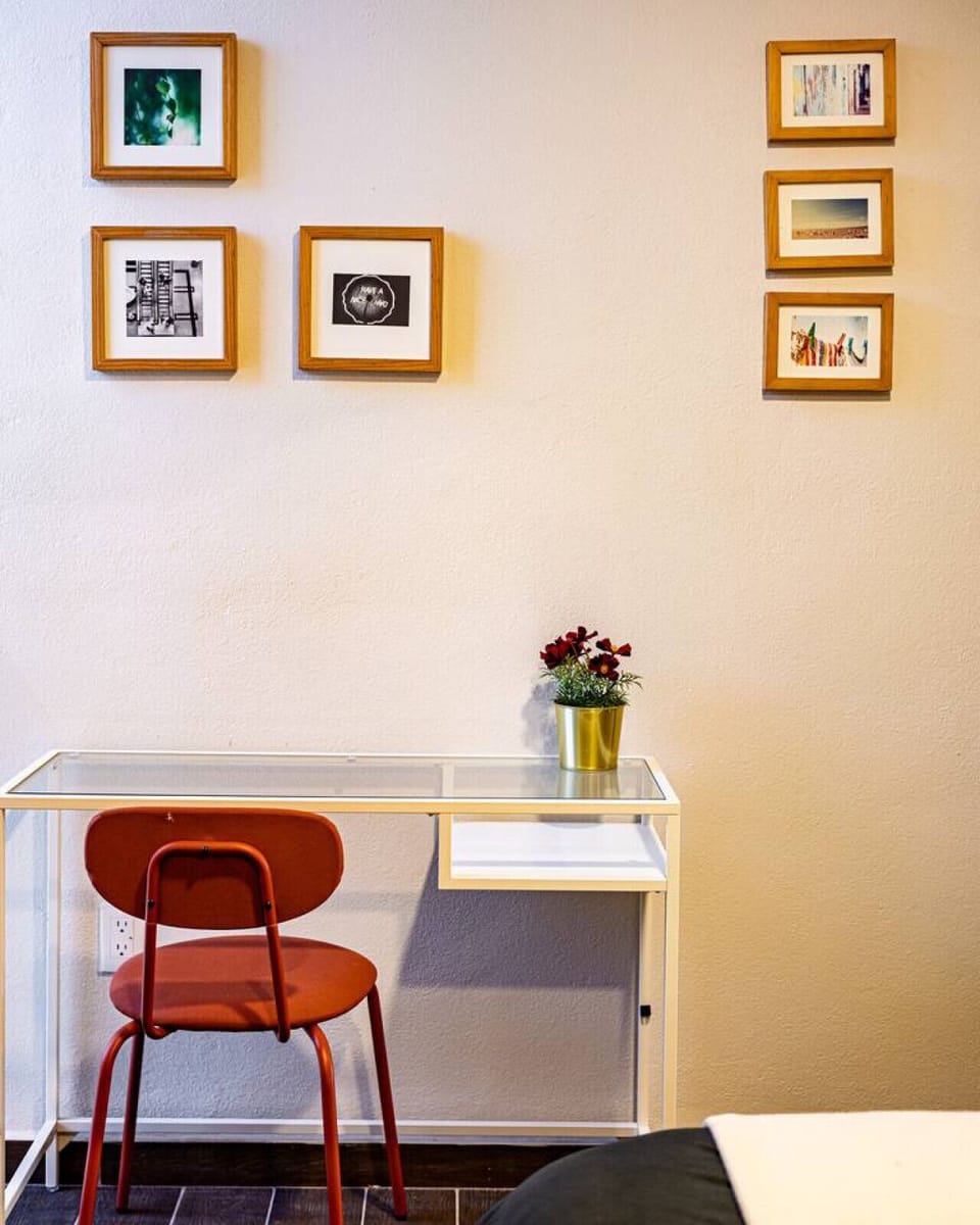 Minimalist workspace with a clean desk and colorful accents for a fresh vibe.