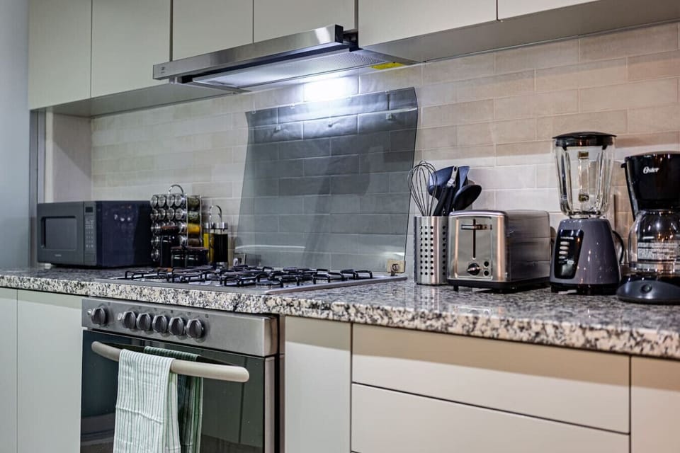 Fully equipped kitchen with all the essentials for a home-cooked meal.