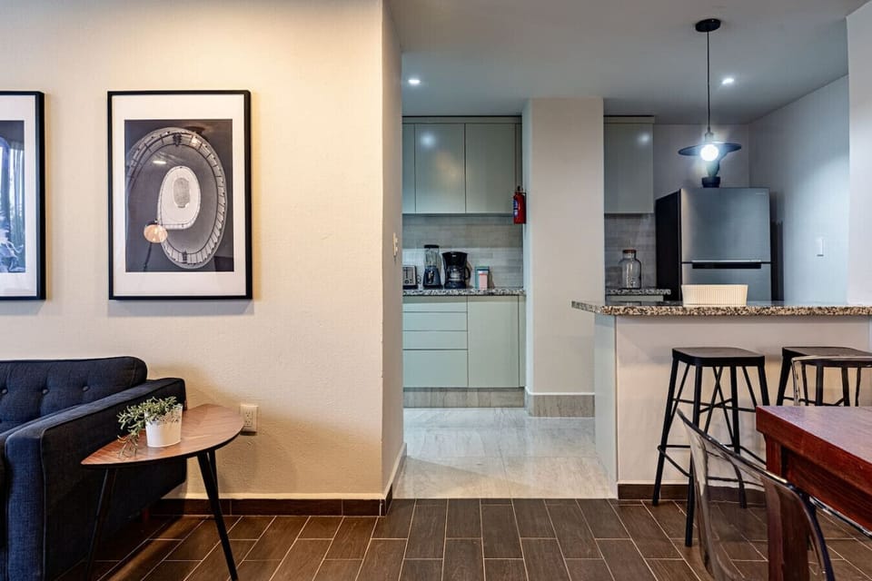 Open and modern living area with chic decor and lots of natural light.