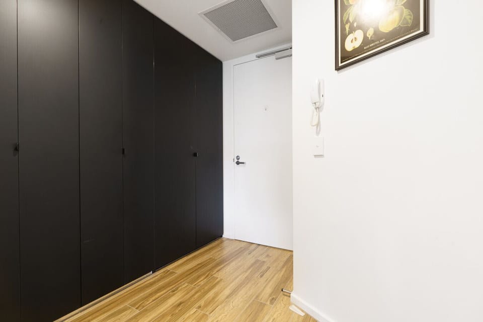 This bright hallway welcomes you with clean architectural lines and a refreshing sense of openness.