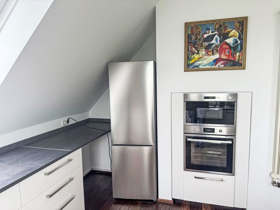 Flooring, Kitchen, Kitchen Appliance, Countertop, Wood, Major Appliance, Floor, Cabinetry, Interior Design, Home Appliance