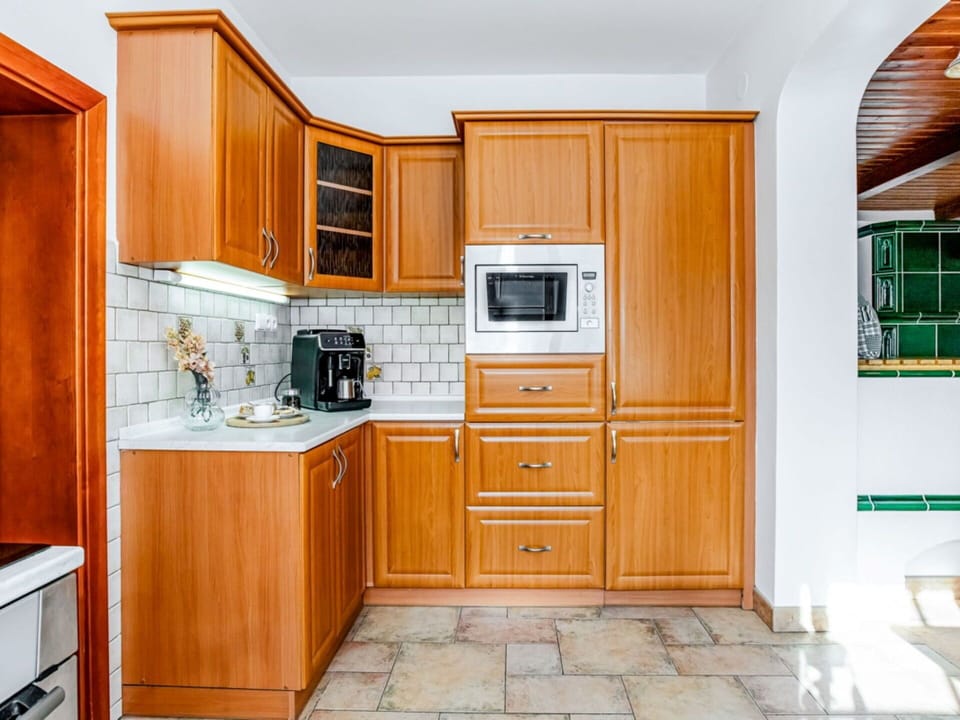 Cabinetry, Kitchen, Kitchen Appliance, Wood, Countertop, Major Appliance, Flooring, Interior Design, Furniture, Cupboard
