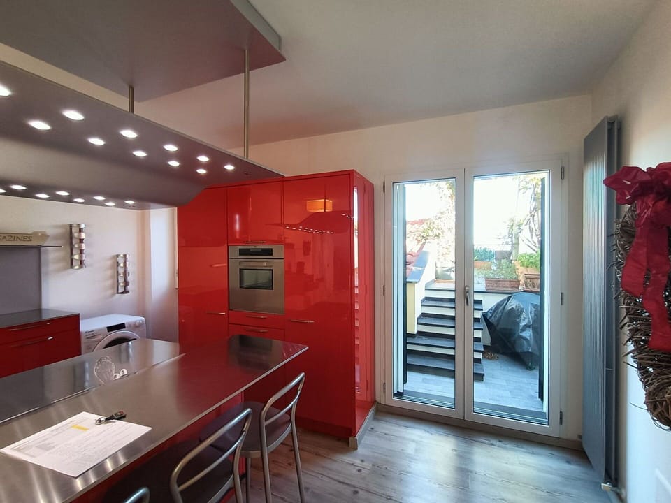 Furniture, Interior Design, Flooring, Kitchen, Ceiling, Wood, Countertop, Floor, Major Appliance, Kitchen Appliance