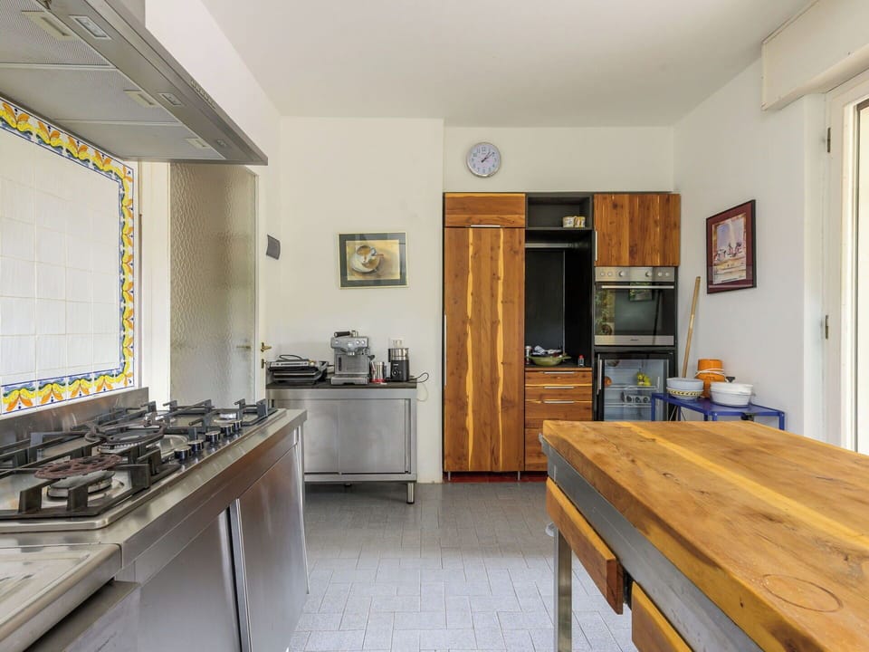 Kitchen, Countertop, Kitchen Appliance, Major Appliance, Kitchen Stove, Flooring, Wood, Interior Design, Cabinetry, Gas Stove
