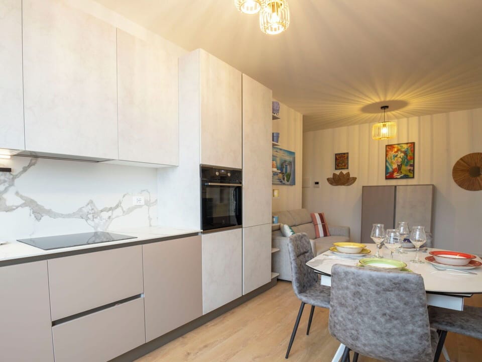 Furniture, Flooring, Kitchen, Interior Design, Countertop, Kitchen Appliance, Floor, Wood, Cabinetry, Major Appliance