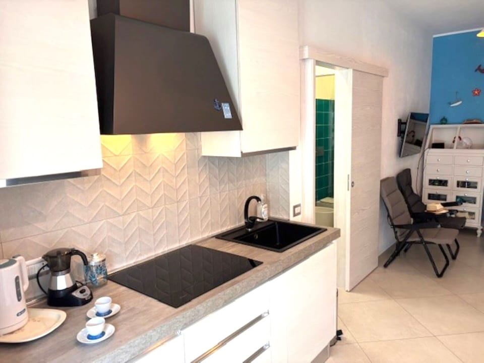 Kitchen, Countertop, Interior Design, Flooring, Kitchen Appliance, Floor, Home, Major Appliance, Cabinetry, Room