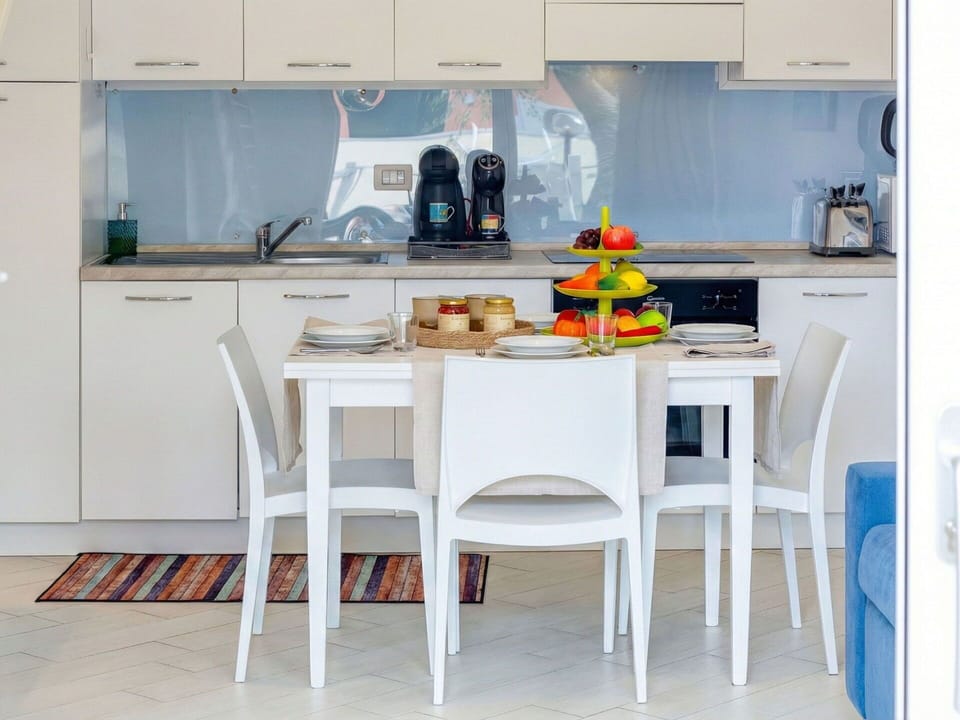 Furniture, Interior Design, Flooring, Kitchen, Table, Chair, Floor, Kitchen & Dining Room Table, Room, Kitchen Appliance