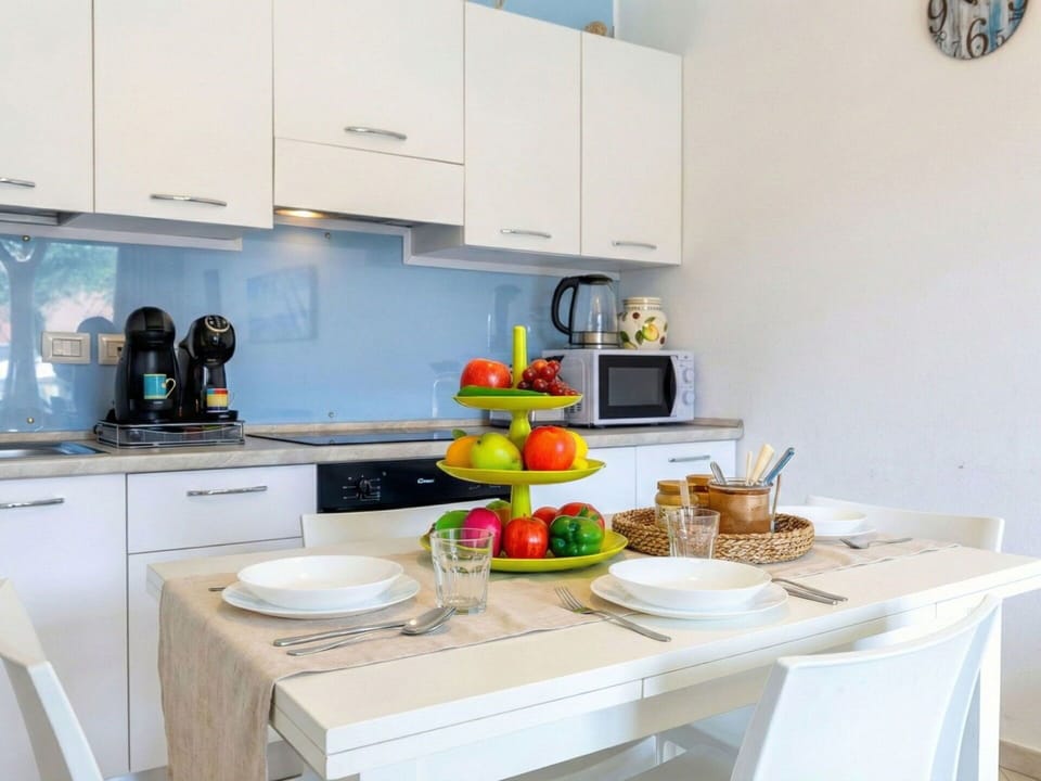 Furniture, Kitchen, Kitchen Appliance, Interior Design, Countertop, Major Appliance, Wood, Flooring, Cabinetry, Tableware