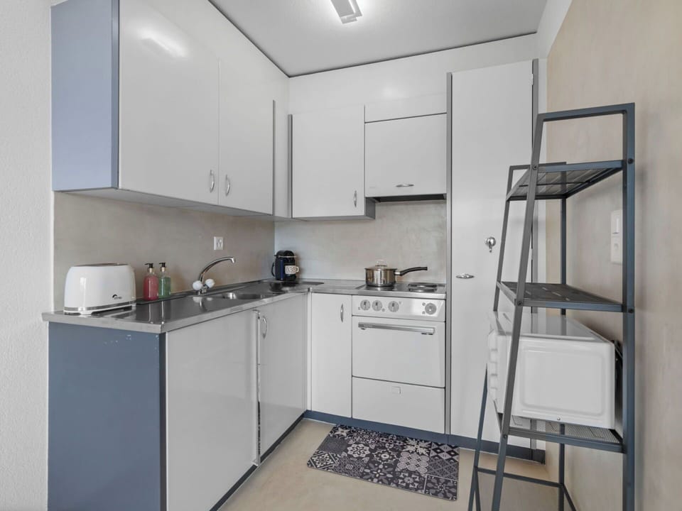 Interior Design, Wall, Flooring, Wood, Ceiling, Furniture, Floor, Room, Lighting, Apartment