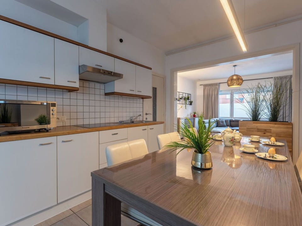 Interior Design, Furniture, Kitchen, Countertop, Flooring, Wood, Ceiling, Cabinetry, Light Fixture, Room