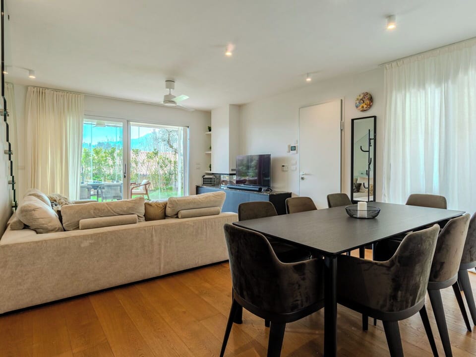 Furniture, Interior Design, Flooring, Floor, Couch, Wall, Table, Room, Wood Flooring, Wood