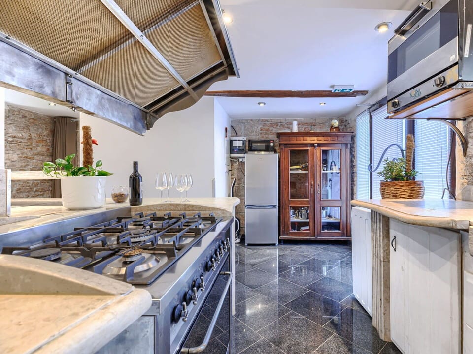 Kitchen, Countertop, Interior Design, Flooring, Major Appliance, Kitchen Appliance, Kitchen Stove, Wood, Ceiling, Cabinetry