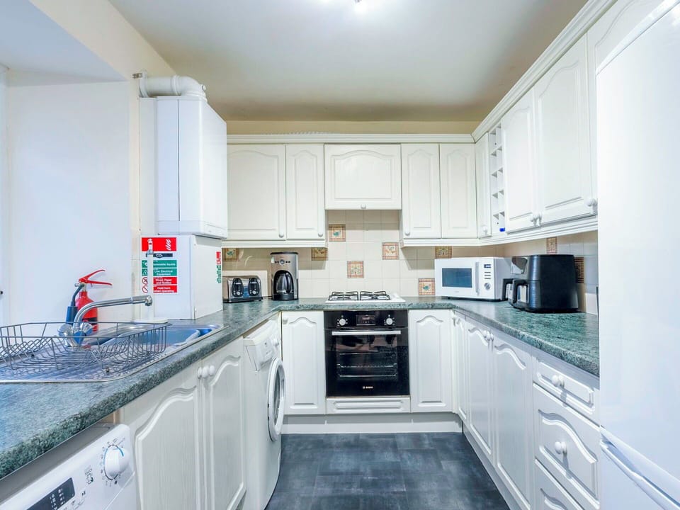 Interior Design, Flooring, Floor, Ceiling, Kitchen, Room, Cabinetry, Apartment, Kitchen Appliance, Countertop