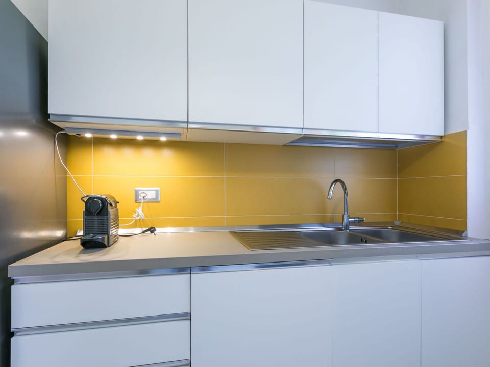 Kitchen, Countertop, Kitchen Sink, Kitchen Appliance, Interior Design, Cabinetry, Sink, Major Appliance, Flooring, Plumbing Fixture