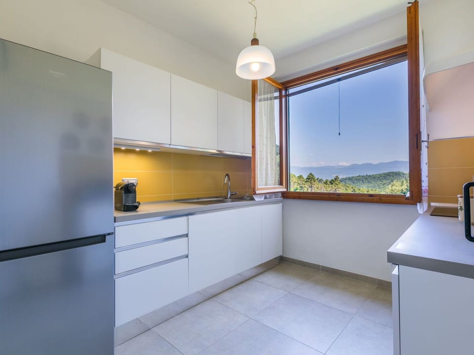 Interior Design, Kitchen, Flooring, Countertop, Wood, Ceiling, Cabinetry, Kitchen Appliance, Floor, Major Appliance