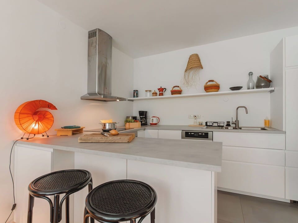 Furniture, Interior Design, Countertop, Kitchen, Flooring, Wood, Ceiling, Light Fixture, Floor, Kitchen Appliance