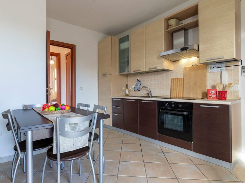 Furniture, Interior Design, Flooring, Kitchen, Wood, Countertop, Kitchen Appliance, Room, Floor, Major Appliance