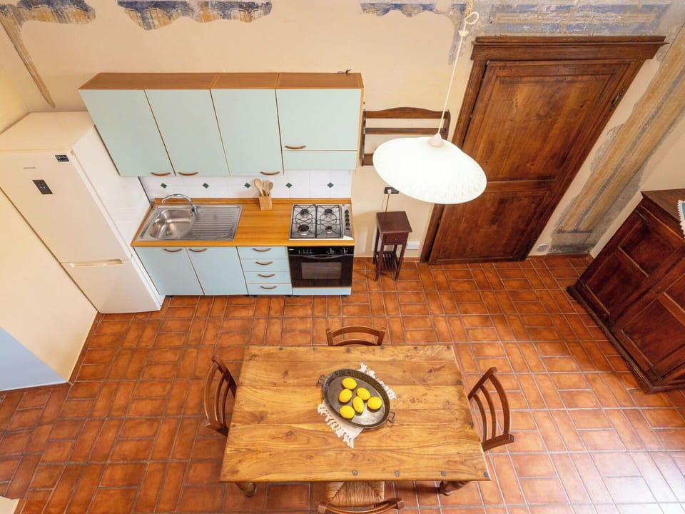 Flooring, Wood, Floor, Interior Design, Furniture, Kitchen, Countertop, Cabinetry, Room, Apartment