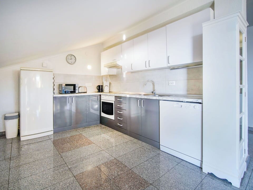 Flooring, Floor, Kitchen, Ceiling, Interior Design, Major Appliance, Countertop, Furniture, Kitchen Appliance, Lighting