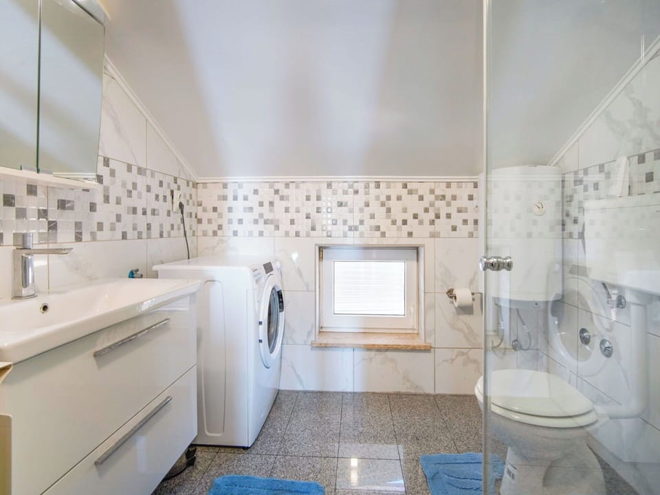 Interior Design, Flooring, Floor, Plumbing Fixture, Ceiling, Bathroom, Light Fixture, Tap, Countertop, Lighting