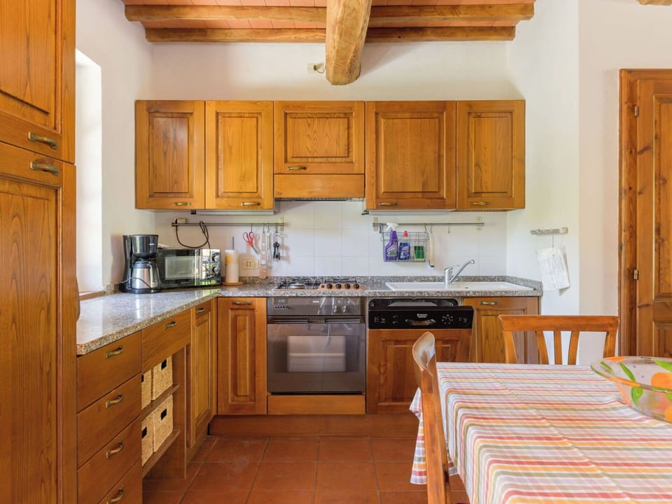 Furniture, Kitchen, Interior Design, Flooring, Cabinetry, Wood, Countertop, Ceiling, Floor, Room