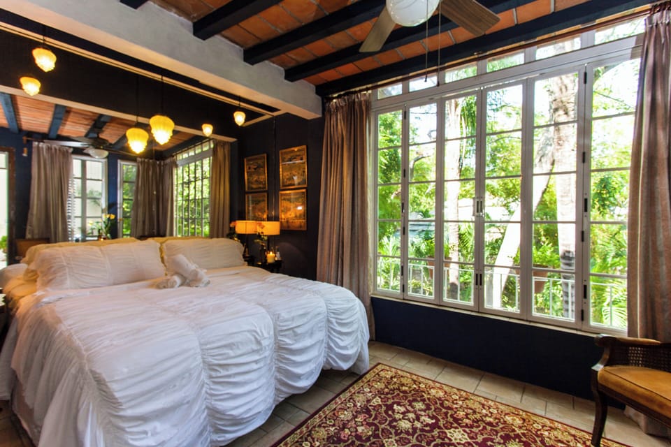 King Bedroom | Premium bedding, in-room safe, iron/ironing board, cribs/infant beds