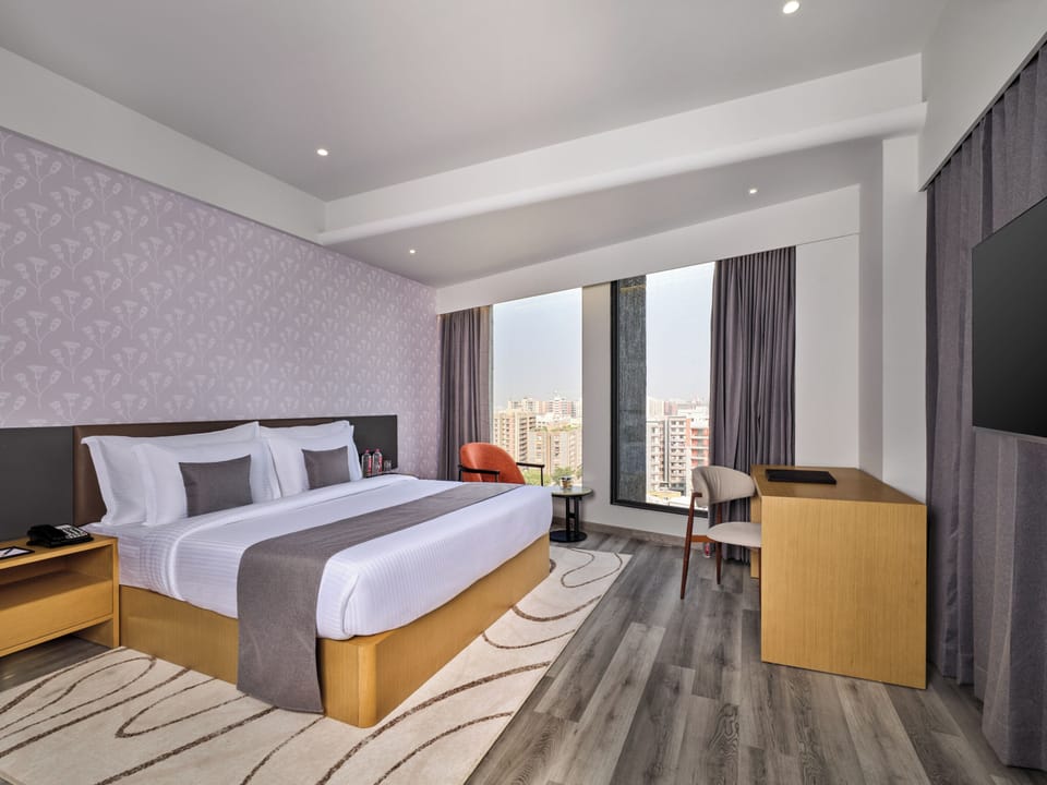 Superior Room | Minibar, in-room safe, desk, iron/ironing board