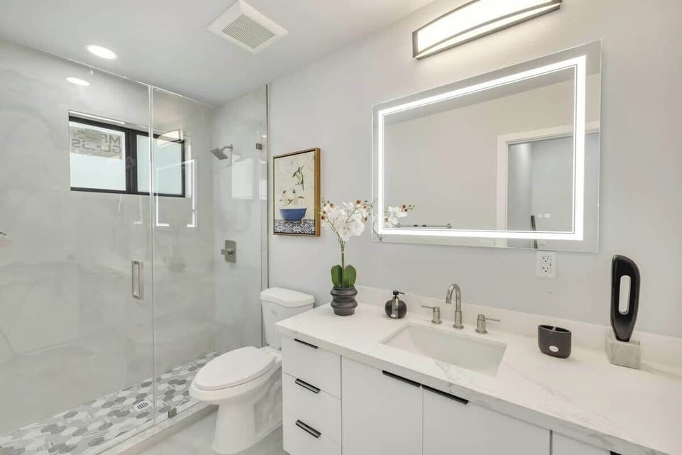 Step into a bright, spa-like sanctuary designed to refresh your senses and elevate your daily routine. This luxurious modern bathroom combines clean lines, premium finishes, and thoughtful touches to create the perfect space for relaxation.