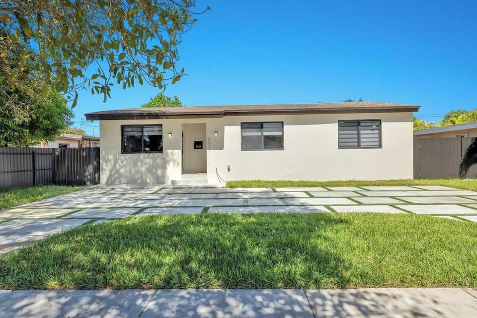 A clean contemporary exterior and a spacious driveway that makes parking a breeze. Surrounded by lush greenery and set on a quiet street.