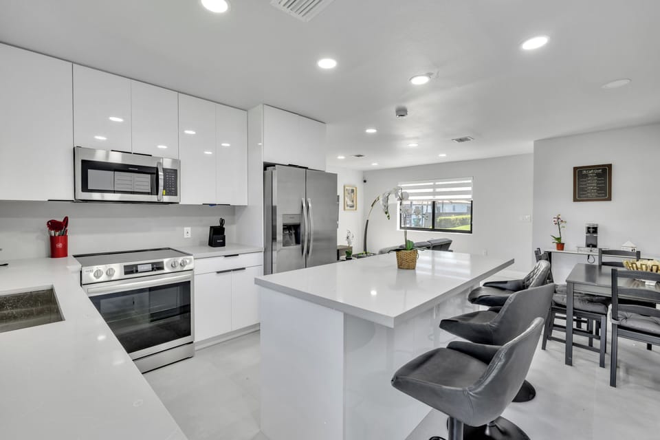 Prepare delicious meals and enjoy gathering in this stunning, state-of-the-art kitchen and dining space, designed for both functionality and style.